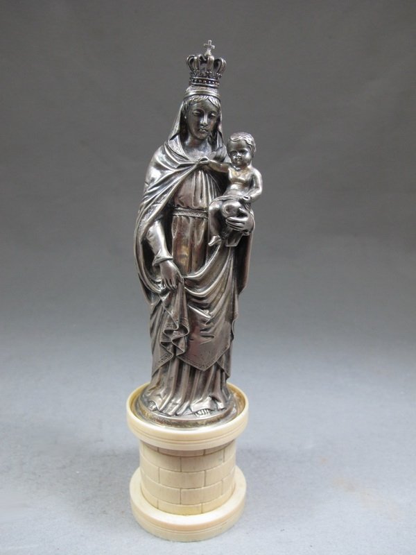 German 800 silver & ivory statue: German 800 silver & ivory statue, marked. 9 1/4" H, 6 3/4" H just the statue. Shipping in USA is $ 30.00. International bidders ask before bid.