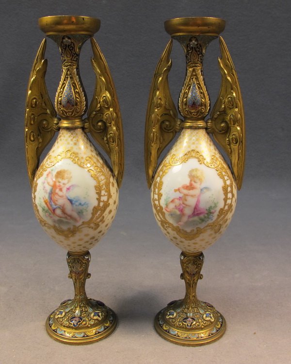 French pair of bronze champleve vases: French pair of bronze champleve vases with an onyx base. 8 5/8" H. Shipping in USA is $ 40.00. International bidder ask for shipping before bid.
