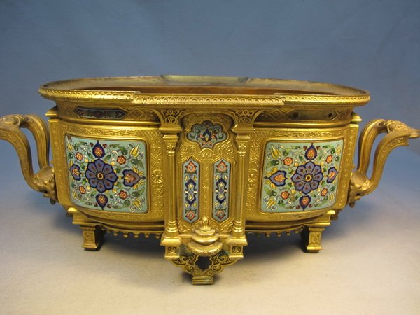 French gilded metal champlevé centerpiece: French gilded metal champlevé centerpiece. 9 5/8" H x 23 5/8" W x 9 7/8" D. Shipping in USA is $ 55.00. International bidders ask before bid.
