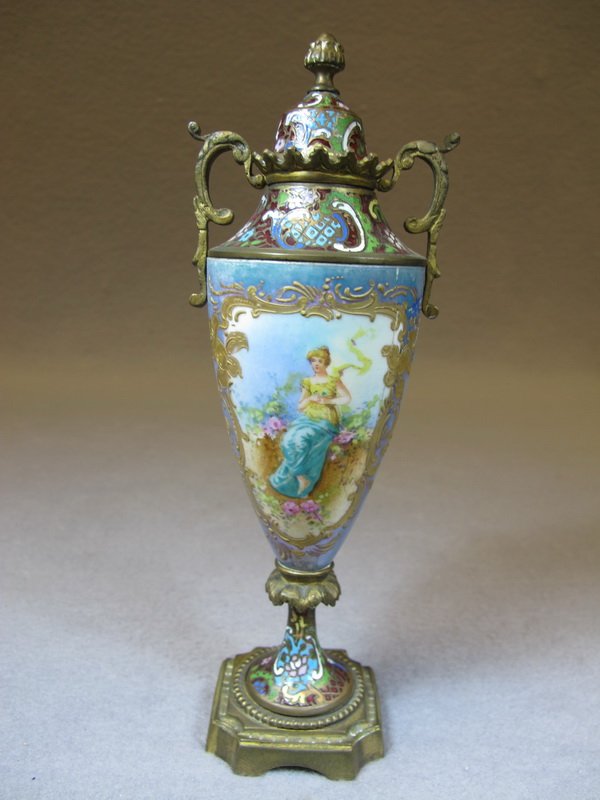 French Sevres bronze champleve urn: French Sevres bronze champleve and porcelain urn, signed. 8 5/8" H. Shipping in USA is $ 25.00. USA or International bidders ask for shipping before bid.