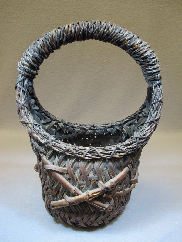 Antique Japanese Bamboo Ikebana basket: Antique Japanese Bamboo and rattan Ikebana basket. 16 1/2" H x 11 1/4” W. Shipping in USA is $ 50.00. International bidders ask before bid