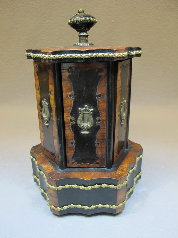 Antique Swiss inlay root & bronze music box: Antique Swiss inlay root & bronze music box, marked and working. 11 1/4” H x 6 1/2” W x 7 1/2” D. Shipping in USA is $ 40.00. USA or International bidders ask for shipping before bid.