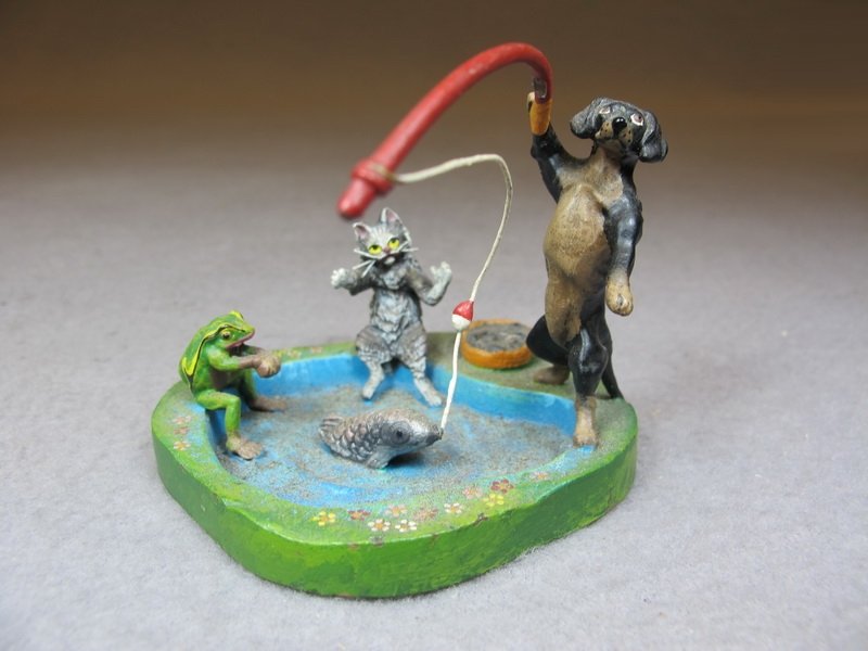 Franz BERGMAN (1898-1963) Vienna bronze dog, cat & frog: Franz BERGMAN (1898-1963) Vienna bronze dog, cat & frog fishing sculpture, marked. 2 3/8” H x 2 7/8” W. Shipping in USA is $ 10.00 plus insurance. International bidders ask for shipping before bid