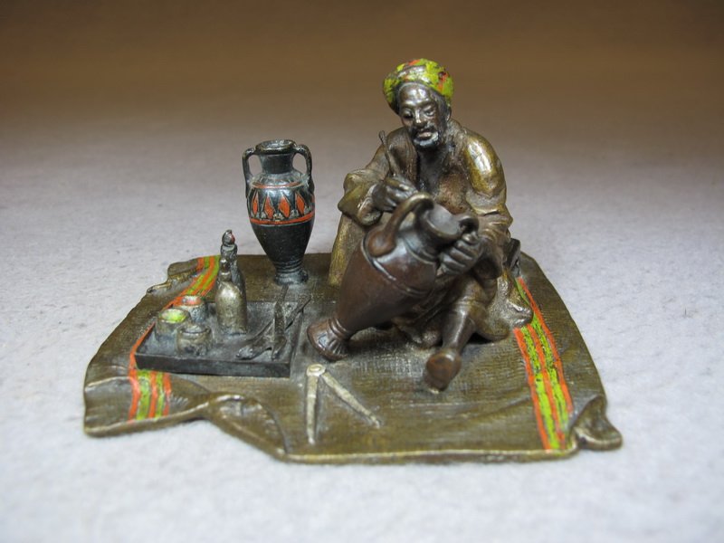 Vienna bronze Orientalist man painting sculpture: Vienna bronze Orientalist man painting sculpture, original painting. 2 3/8” H x 3 7/8” W x 3 1/8” D. Shipping in USA is $ 10.00 plus insurance. International bidders ask for shipping before bid.