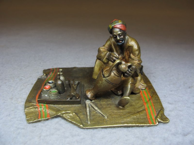 Vienna bronze Orientalist man painting sculpture: Vienna bronze Orientalist man painting sculpture, original painting. 2 3/8” H x 3 7/8” W x 3 1/8” D. Shipping in USA is $ 10.00 plus insurance. International bidders ask for shipping before bid.