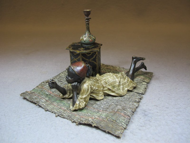 Franz BERGMAN (1898-1963) Vienna bronze boy inkwell: Franz BERGMAN (1898-1963) Vienna bronze boy inkwell, signed, original painting. 4 1/8” H x 5 1/2” W x 5 7/8” D. Shipping in USA is $ 10.00 plus insurance. International bidders ask for shipping 