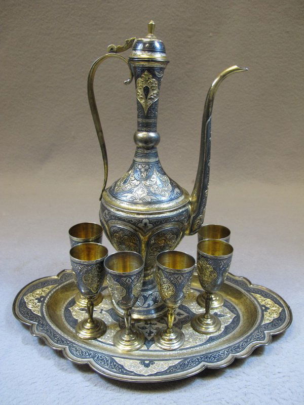 Antique Russian silver tea set: Antique Russian silver tea set, marked, from Kubachi, Dagestam. Pitcher: 11 1/4” H, Tray: 11 3/4” H X 8” W and cups: 3 1/2” H. Shipping in USA is $ 45.00. USA or International bidders ask for