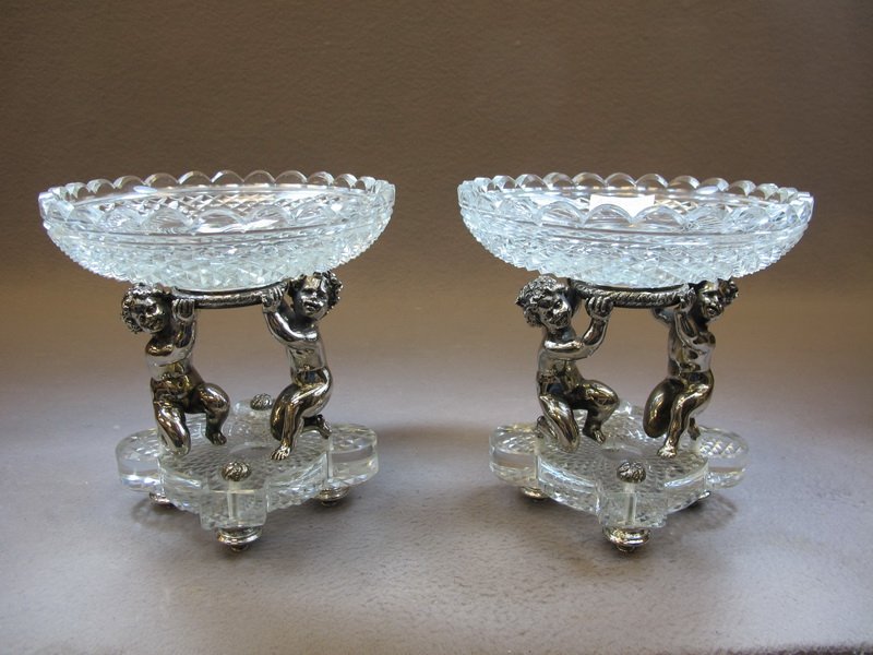 20th C signed Baccarat pair of centerpieces: 20th C signed Baccarat pair of silverplate bronze & glass centerpieces. 8” H x 7 3/4” W. Shipping in USA is $ 50.00. USA or International bidders ask for shipping before bid.