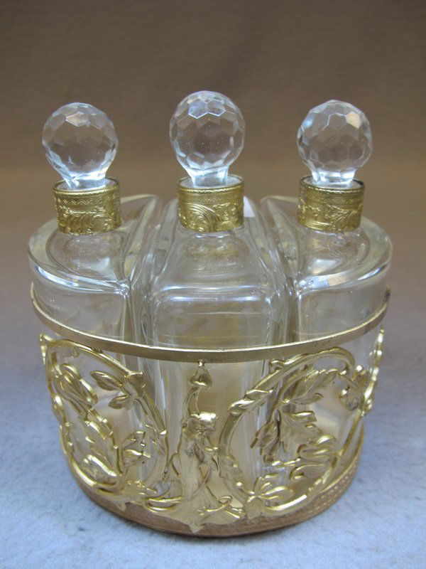 Baccarat style French set of 3 perfurm bottles: French set of 3 perfurm bottles. 5” H x 4 3/4” W x 3 3/4” D. Shipping in USA is $ 15.00. USA or International bidders ask for shipping before bid.