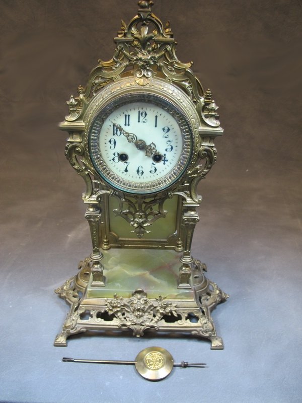 Antique Gustav Becker Freiburg bronze & onyx clock: Antique Gustav Becker Freiburg bronze & onyx clock, marked. 17" H x 10 1/4” W. Shipping in USA is $ 55.00. International bidders ask before bid.