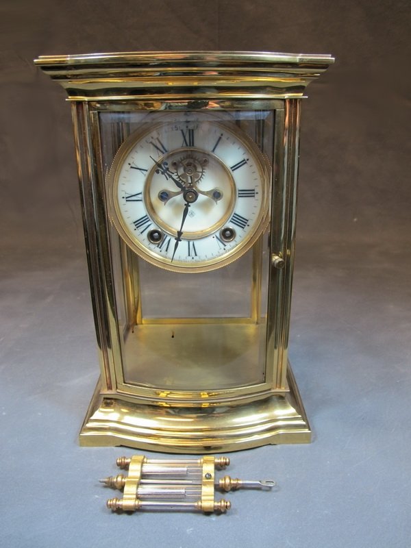 American Ansonia bronze & glass clock: American Ansonia bronze & glass clock, marked. 11 1/4" H x 7 1/4” W. Shipping in USA is $ 45.00. International bidders ask before bid.