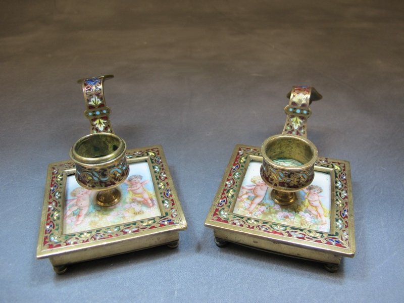 Antique pair of bronze champleve candlesticks: Antique pair of bronze champleve & porcelain candlesticks. 2 1/4” H x 5” W x 2 7/8” D. Shipping in USA is $ 25.00. International bidders ask for shipping before bid.