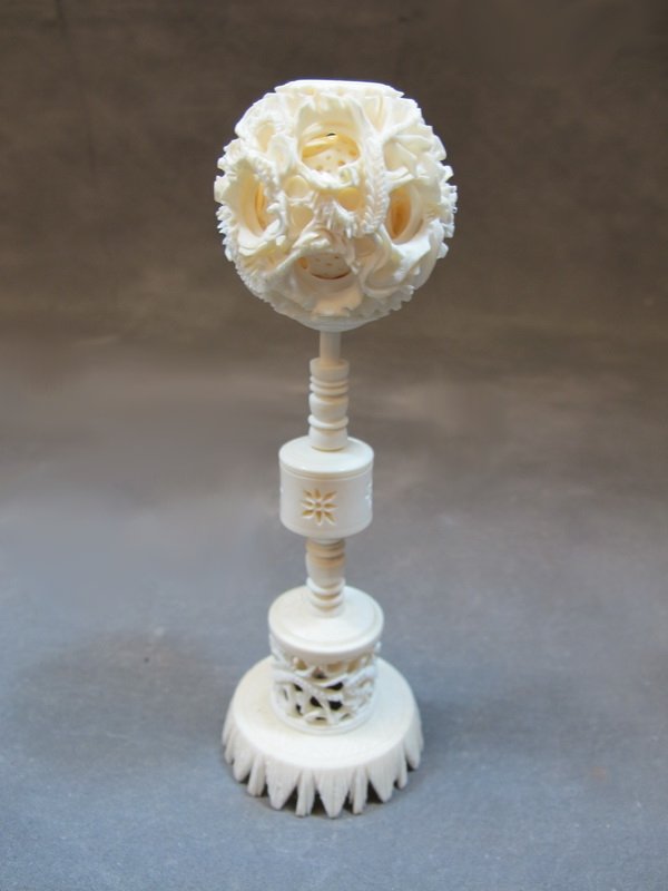 Old Chinese carved ivory puzzle ball with stand: Old Chinese carved ivory puzzle ball with stand. 7 1/8” H. Shipping in USA is $ 20.00. International bidders ask for shipping before bid.