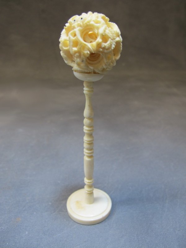 Old Chinese carved ivory puzzle ball with stand: Old Chinese carved ivory puzzle ball with stand. 5 3/8” H. Shipping in USA is $ 15.00. International bidders ask for shipping before bid.