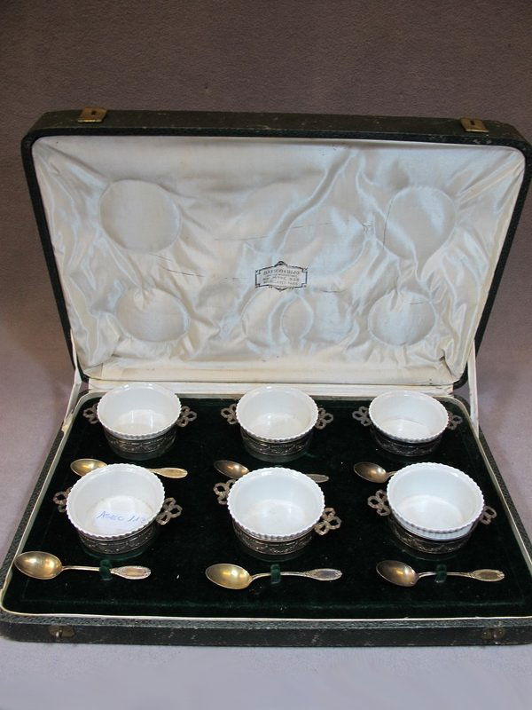 Antique French silver & porcelain set of 6 cups: Antique French silver & porcelain set of 6 cups and 6 spoons in a box, marked EC 800 and EC 950 on the silver. Box: 3" H x 17 1/2" W x 11 1/2” D, Cup” 1 3/4” H x 4 1/4” W. Shipping in USA is $