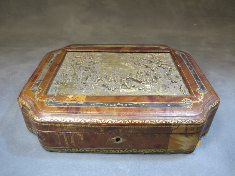 Antique bronze, wood & leather box: Antique bronze, wood & leather box. 3 1/4” H x 13 1/2” W x 10 5/8” D. Shipping in USA is $ 40.00. USA or International bidders ask for shipping before bid.