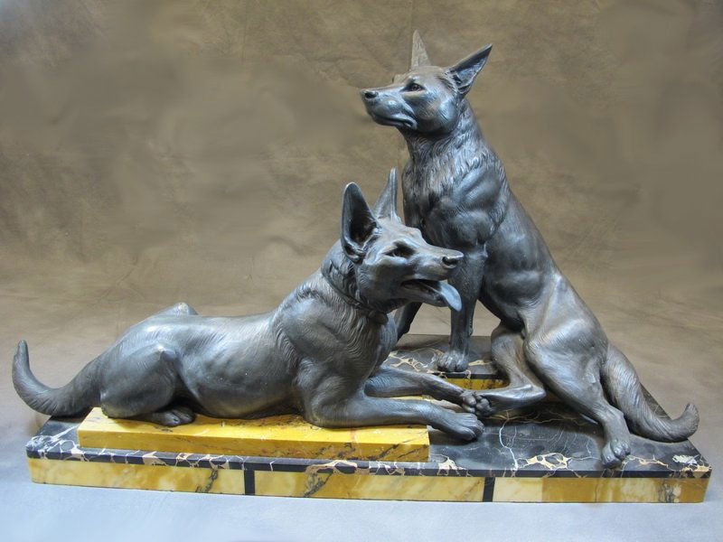 L. CARVIN 2 German Shepherd dogs spelter statue: L. CARVIN 2 German Shepherd dogs spelter statue on a marble base, unsigned, around 1930/40. 16 5/8” H x 28 1/2” W. Shipping in USA is $ 75.00. International bidders ask for shipping before bid.