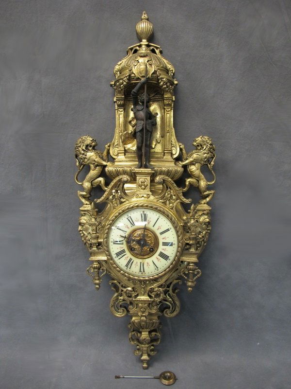 Old European bronze wall clock: Old European bronze wall clock. 33 1/2” H. Shipping in USA is $ 110.00. International bidders ask for shipping before bid.