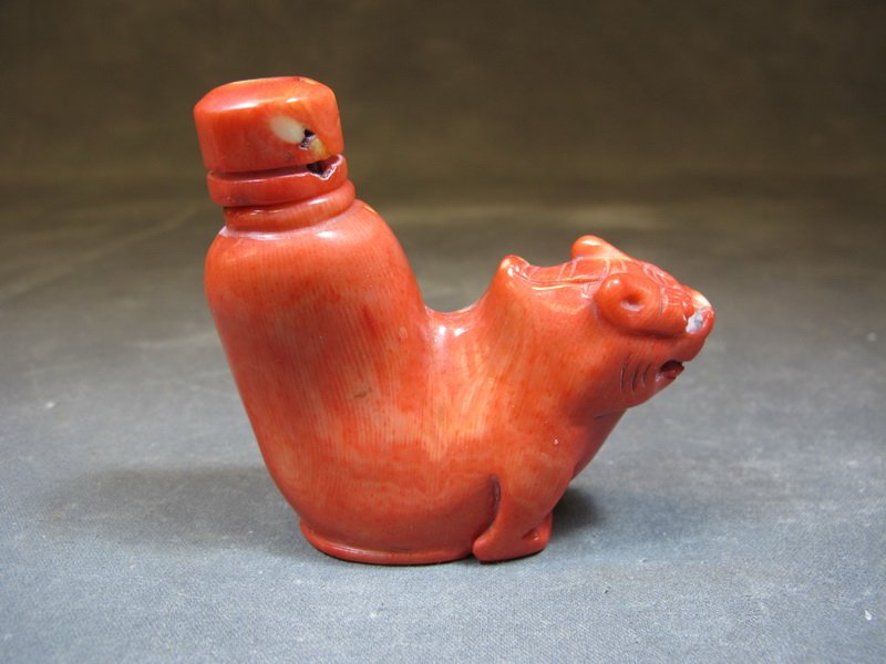 Old Asian coral perfurm bottle: Old Asian coral perfurm bottle. 3 1/4" H x 3 1/4” W. Shipping in USA is $ 15.00. International bidders ask for shipping before bid.