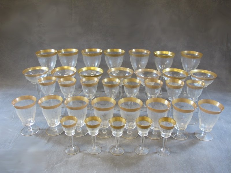 Vintage gilded glasses 35 pcs set: Vintage gilded glasses 35 pcs set. 7 water glasses, 7 champagne glasses, 8 wine glasses, 8 wine glasses and 5 liquor glasses. Shipping in USA is $ 100.00. International bidders ask for shipping before