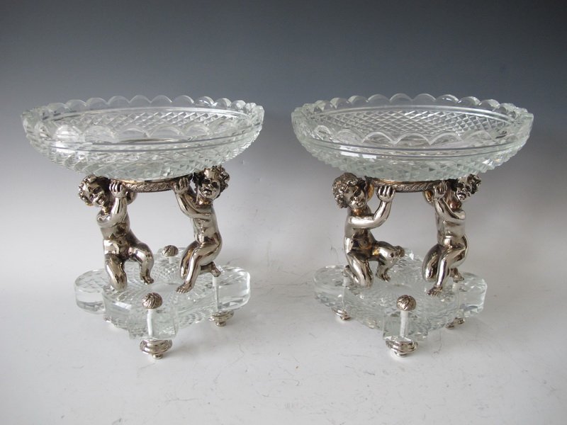 20th C signed Baccarat pair of centerpieces: 20th C signed Baccarat pair of silverplate bronze & glass centerpieces. 8” H x 7 1/2” W. Shipping in USA is $ 50.00. USA or International bidders ask for shipping before bid.