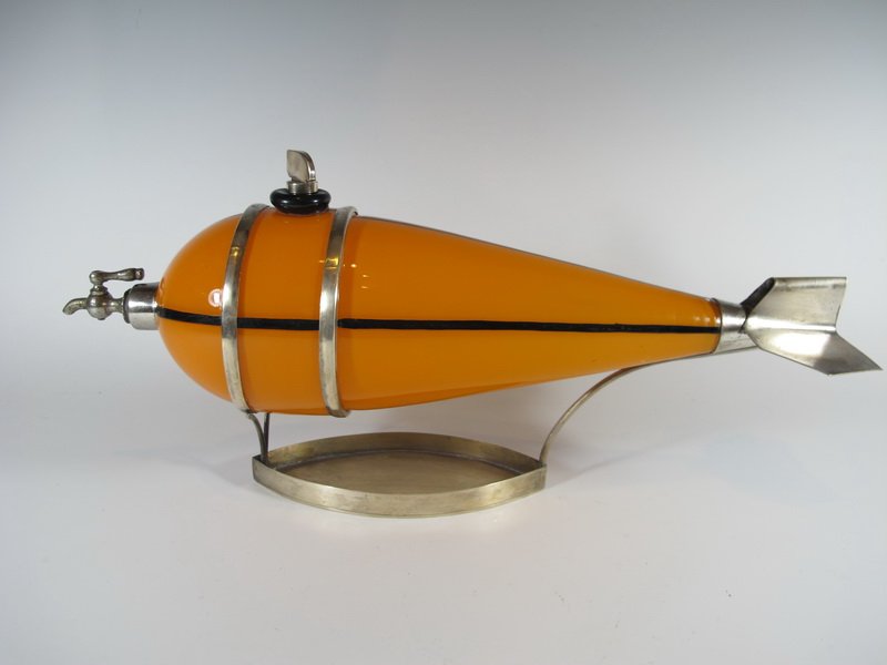 Art Deco metal & glass licor bottle: Art Deco metal & glass licor bottle. 6 1/8â€ H 12 7/8â€ W. Shipping in USA is $ 40.00. International bidders ask for shipping before bid.