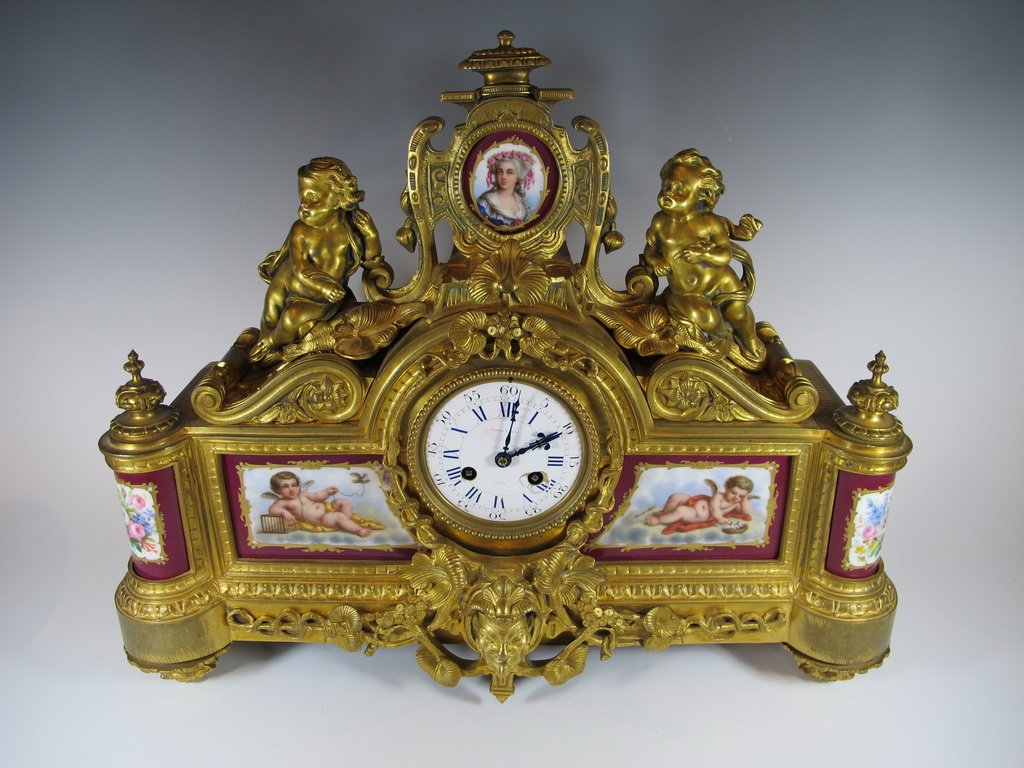 Lester & Sons, Paris bronze & porcelain clock: Lester & Sons, Paris bronze & porcelain clock, marked. 14 1/4” H x 17 1/2” W x 5 1/2” D. Shipping in USA is $ 55.00. International bidders ask for shipping before bid.