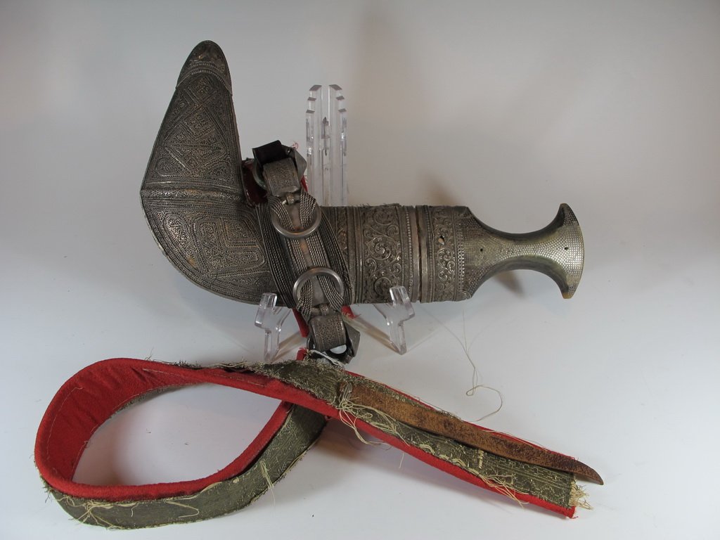 Antique Moroccan silver dagger: Antique Moroccan silver dagger. 12” H x 7 1/2” W. Shipping in USA is $ 40.00.International bidder ask for shipping before bid.