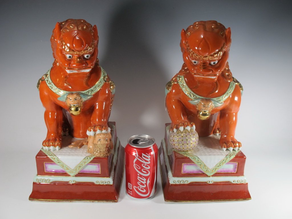 Old Chinese pair of porcelain Foo Dogs statues: Old Chinese pair of porcelain Foo Dogs statues, marked. 14” H x 7 1/8” W x 8 1/2” D. Shipping in USA is $ 50.00. International bidders ask for shipping before bid.