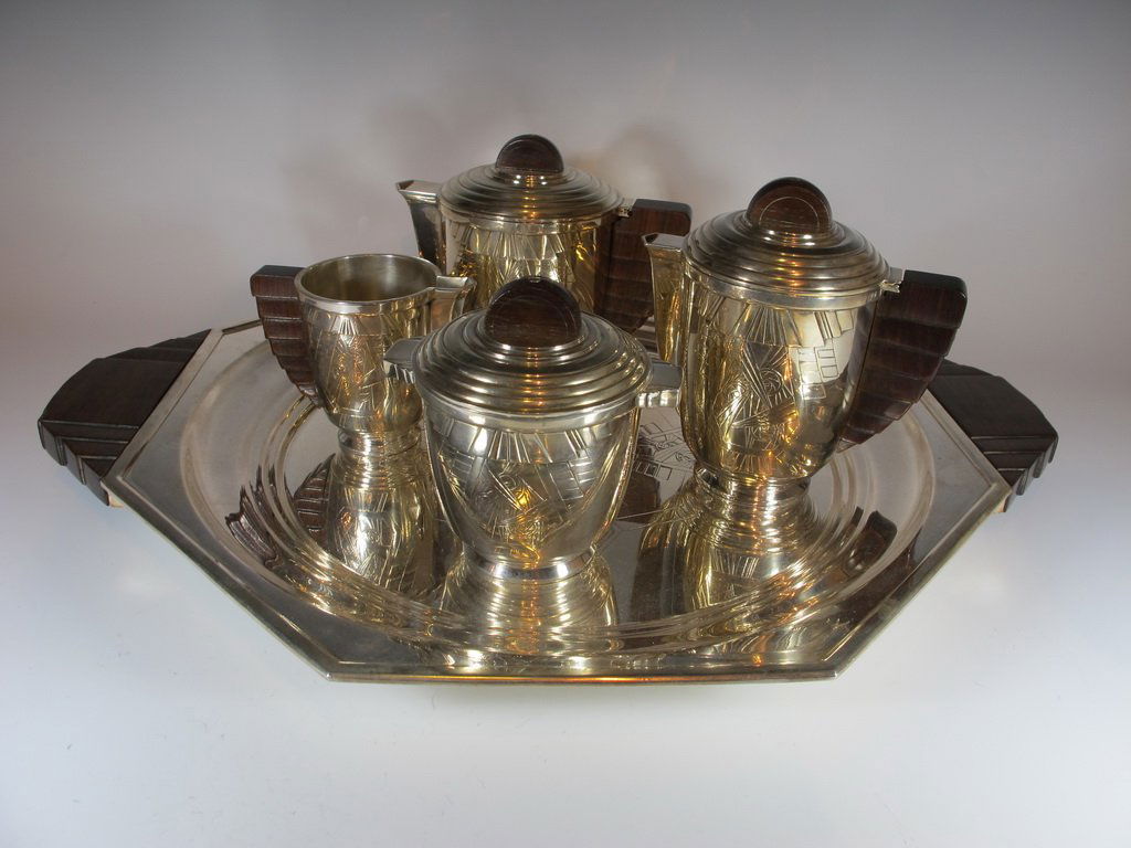 Art Deco English silverplate teapot set: Art Deco English silverplate teapot set, marked. Tray: 22 1/2" H x 18” W, Teapot: 6 1/2” H. Shipping in USA is $ 60.00. International bidders ask for shipping before bid.