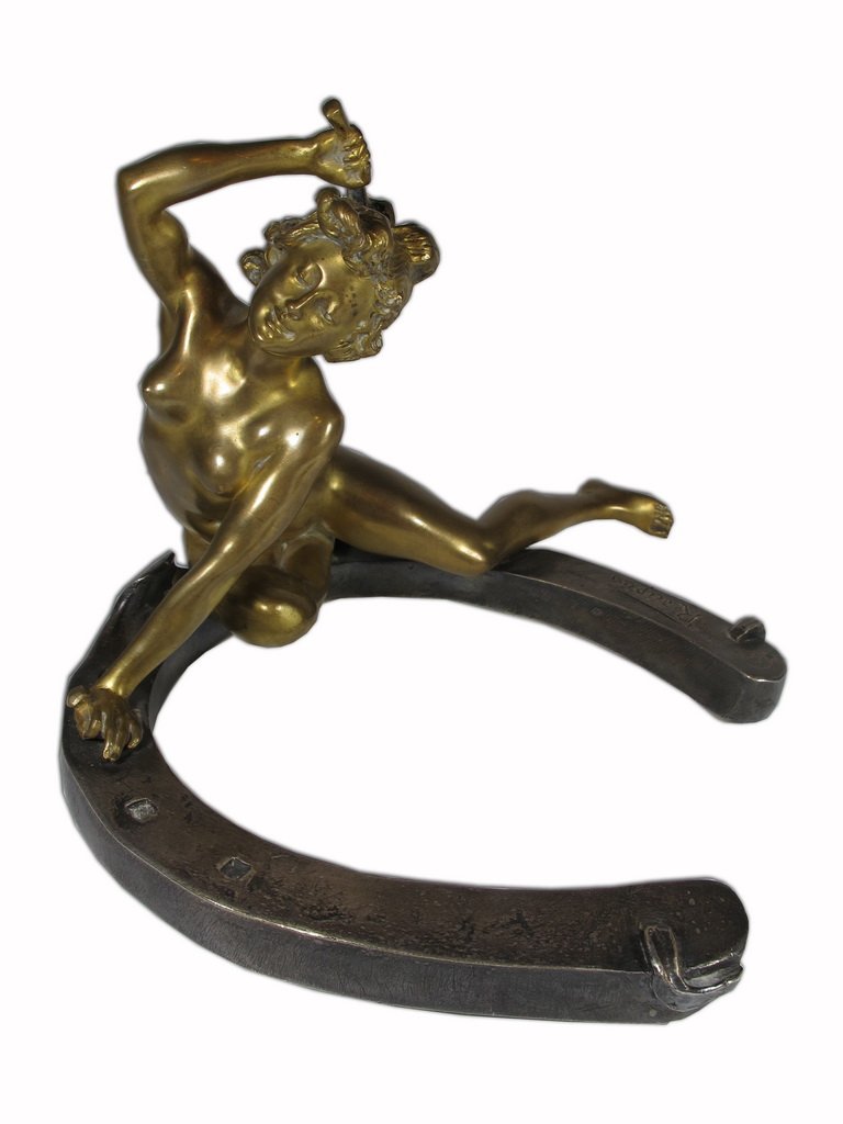 Georges RÉCIPON (1860-1920) Susse Freres nude sculpture: Georges RÉCIPON (1860-1920) Susse Freres nude bronze sculpture, lady on a horseshoe, titled: “ Le porte bonheur” . 5 1/2” H x 8” W x 7” D. Shipping in USA is $ 20.00. International bidders