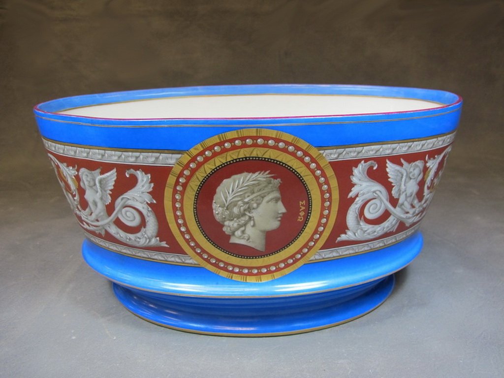 Probably French porcelain centerpiece: Probably French porcelain centerpiece, unmarked. 6 3/4” H x 13 5/8” W x 9” D. Shipping in USA is $ 45.00. International bidders ask for shipping before bid.
