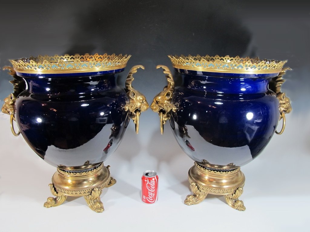 Antique French Sarreguemines pair of porcelain & bronze: Antique French Sarreguemines pair of porcelain & bronze vases, signed. 22 1/4” H x 21” W x 9” D. Shipping in USA is $ 140.00. International bidders ask for shipping before bid.