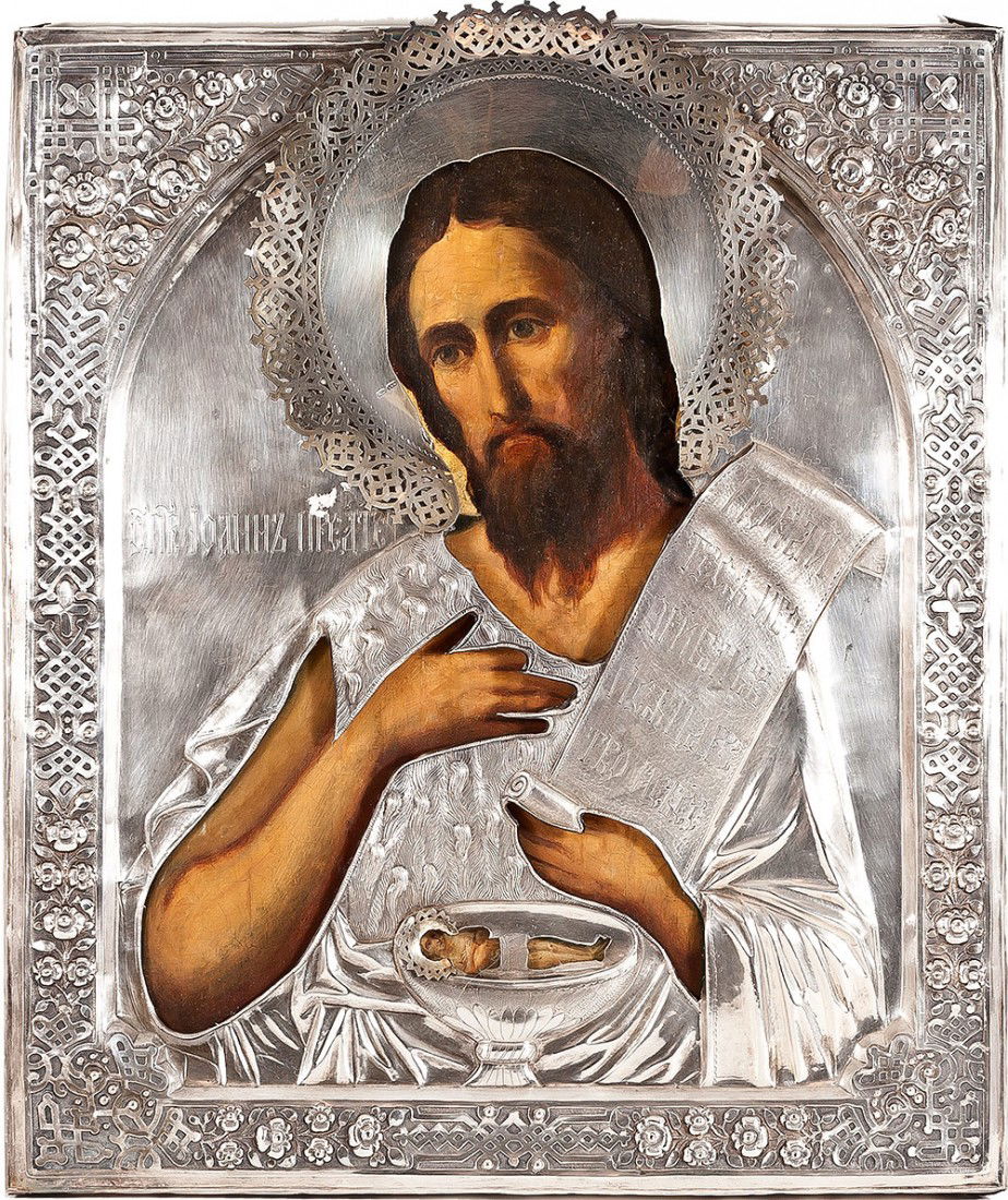 Russian icon: John the Theologian with silver cover.: Russian icon: John the Theologian with silver cover. 19th Century. Moscow. Egg tempera and gesso on wood panel. Two splint on the back. Overlade with silver repose cover. Hallmarked St. Petersburg, Im