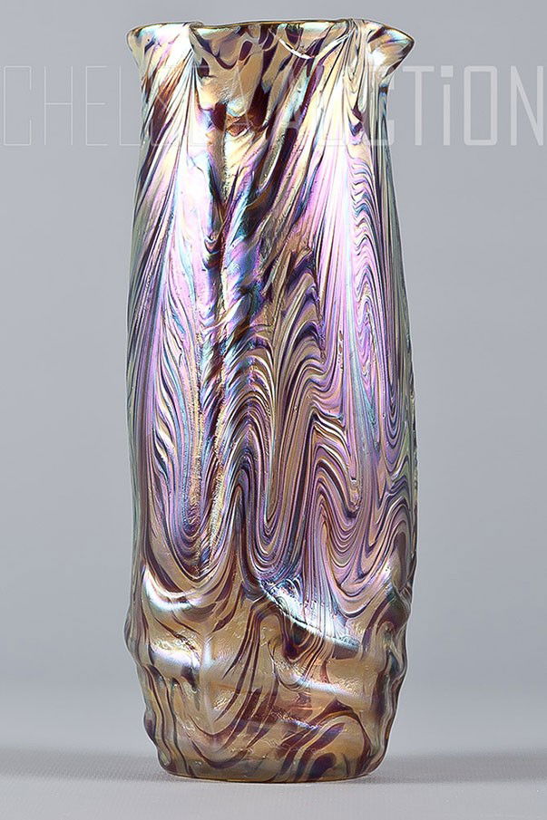 Art Deco multicolored Vase: Art Deco multicolored iridescent Loetz or Koloman Moser vase. C. 1910. The vase has hand polished pontil and fire polished top. Excellent condition. Size: H 8 3/8” W 3”