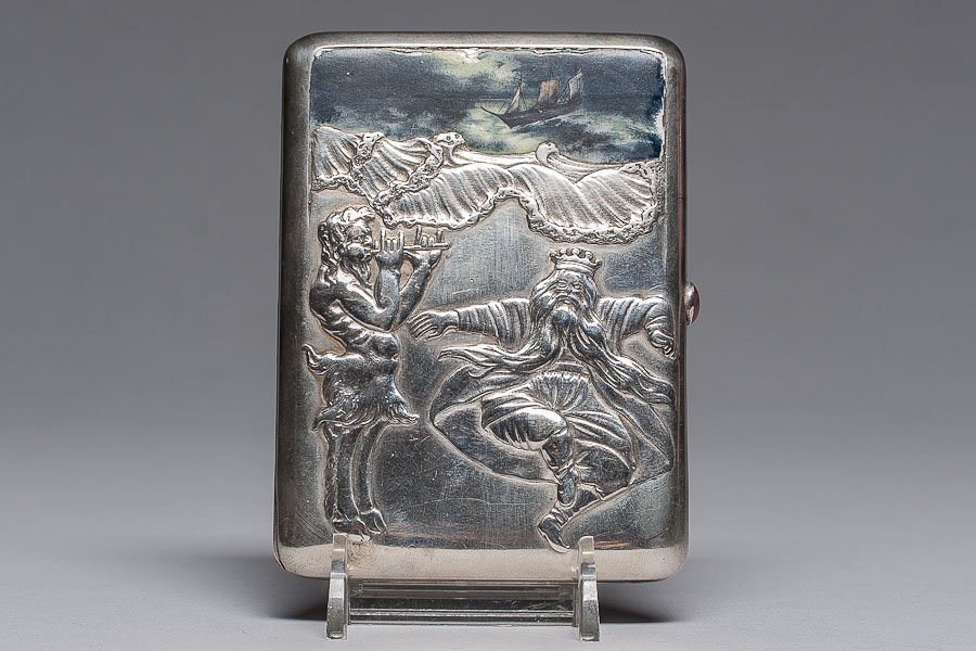 SILVER CIGARETTE HOLDER (RUSSIA): 19th century Russian silver cigarette holder with dancing Neptune, silver gilt on inside. On top of the case is the seascape in enamel (clipper in the rough sea). Marked Russia silver standard 84 (875
