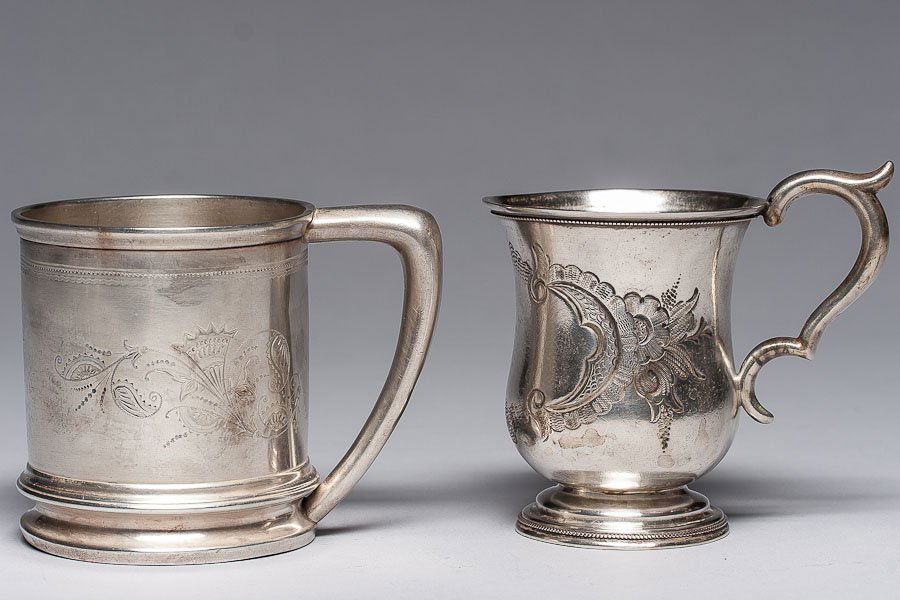 19th C. American Silver by E.J. Baldwine & Co.: 19th Century coin silver creamer by E.J. Baldwine & Co. SIZE: H- 3 ½” (9 cm) D 2 ¾” (7 cm) and 19th Century sterling silver tea cup holder. SIZE: H 3 ½” (9 cm) D 2 ¾” (7 cm)