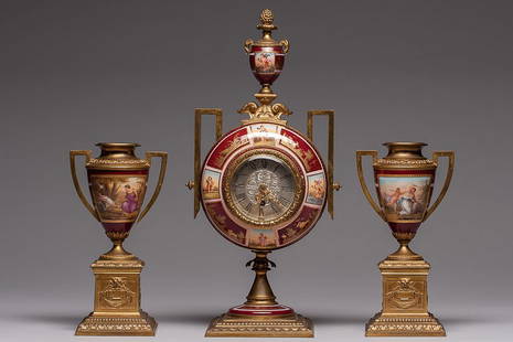 19th C. Royal Vienna Clock with Two Urns: Royal Vienna 19th century clock with two urns on each side. This is a combination of bronze and porcelain, hand painted and signed. SIZE: Clock: Base 4 ½” x 4 ½” (11.5 x 11.5 cm.) H 13 ½” (34