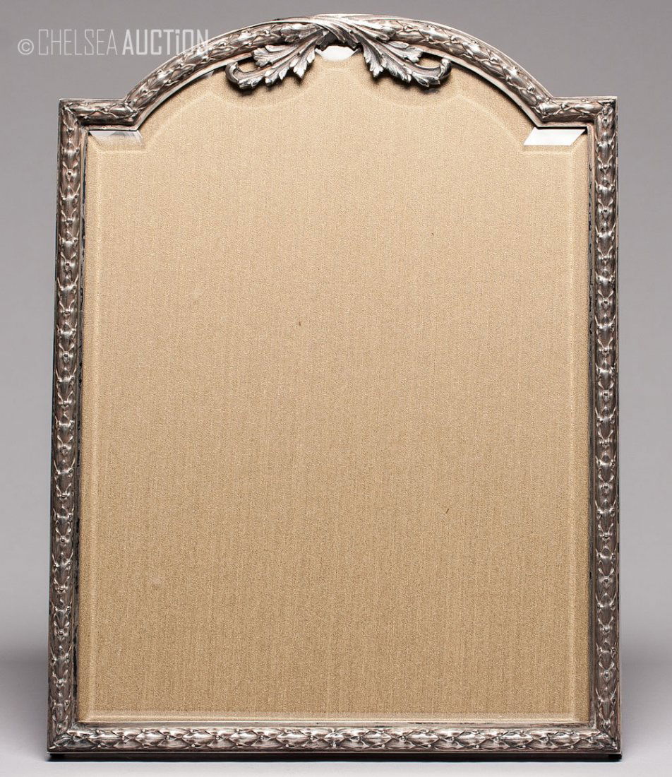 Antique Russian Silver & Wood Frame by Grachev: Russian silver overlaid wooden picture frame with original beveled glass. Hallmarked Moscow, Imperial warrant and 84 standard (875/1000 silver), maker mark Cyrillic “BR. GRACHEV”. SIZE: L 13 in an