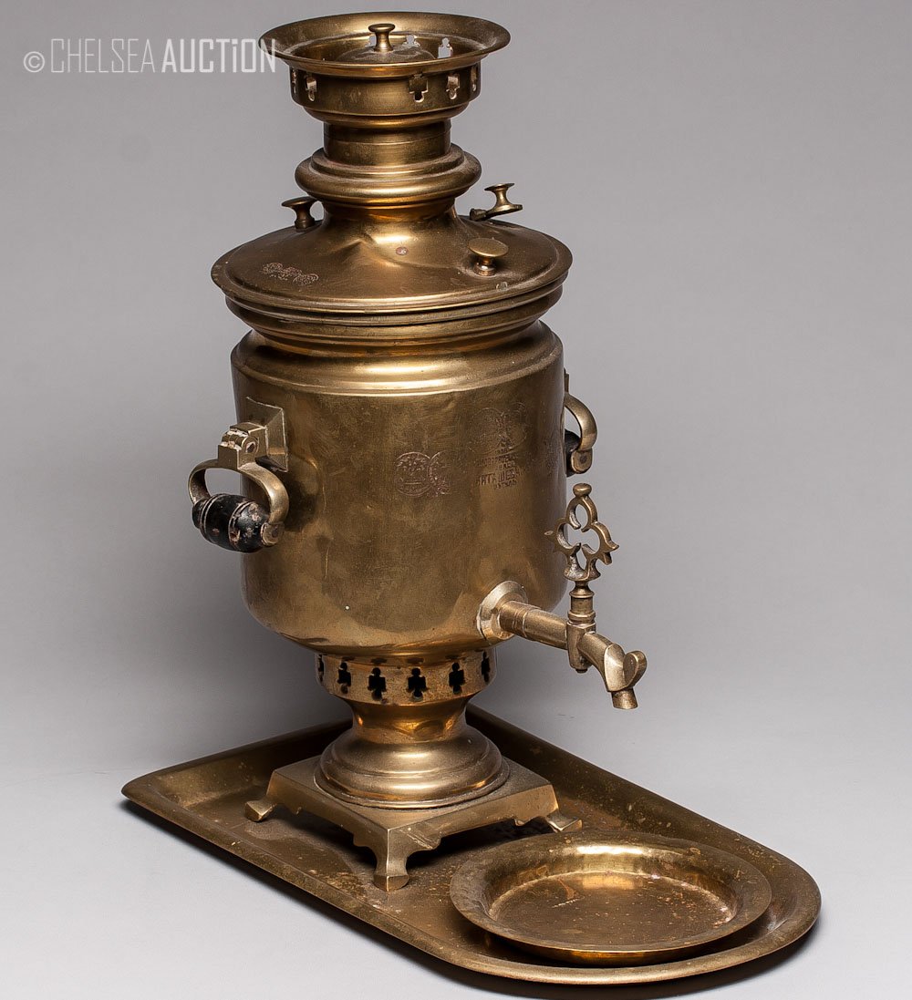 1908 Russian Brass ‘Samovar’: 1908 Russian brass ‘Samovar’ comes with matching tray and bowl. Marked by maker. SIZE: Samovar: L 15 in and W 9 1/2 in (38 cm X 24 cm) Bowl: L 5 3/4 in and W 5 3/4 in (14.5 cm X 14.5 cm) Tray: L 1