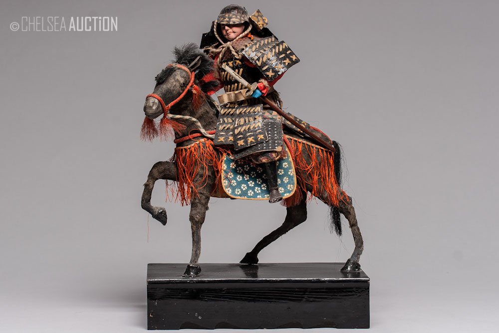 19th C. Japanese Mounted Samurai Doll: 19th century Japanese Doll of a mounted Samurai. SIZE: H 12 in (30.5 cm), L 8 3/4 in and W 4 1/2 (22 in x 12 cm)