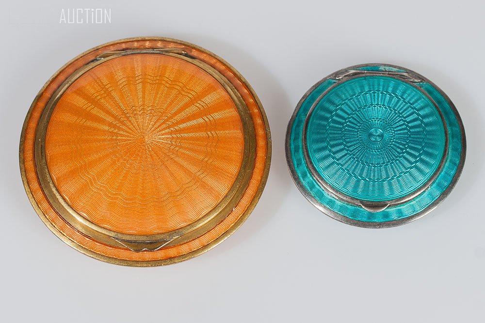 Austrian Orange Brass & Silver Blue Enamel Compact: Austrian, orange gilded brass compact and silver blue enamel compact. Diameter: Orange: 2.5 inches (6.5cm) Blue: 1 5/8 inches (4.5cm)