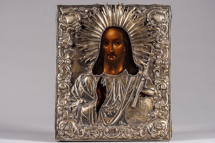 Russian Icon: Christ Pantocrator: 19th century icon, egg tempera and gesso on wood panel, inset splits on top and bottom. Overlaid with silver, gilded reposes and chased cover (oklad). Hallmarked Moscow, 84 standard (875/1000) silver,