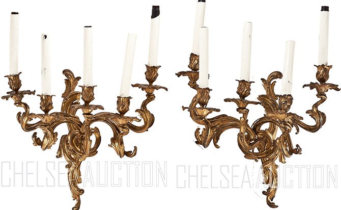 Late 19th C French Bronze Five-light Wall Sconces: A pair of French bronze five-light wall sconces, late 19th century, each with floriform nozzles, leaf-form stems joining wall mounts, scrolling foliage and flowers. Size: 22" x 16 1/2"