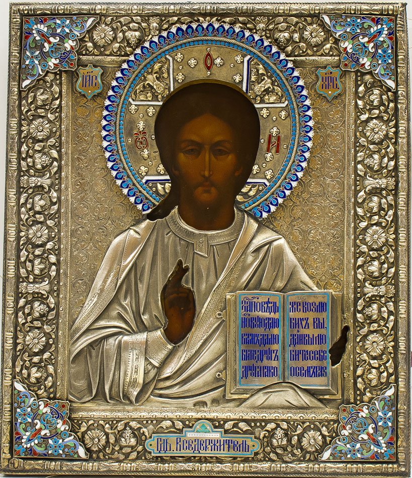 A RUSSIAN ICON OF CHRIST PANTOCRATOR: A Russian icon of Christ The Pantocrator with silver-gilt repoussÃ©, chased and engraved oklad and cloisonne and champleve enamel. Hallmarked 1893, Moscow, 84 standard (875/1000 silver), silversmith