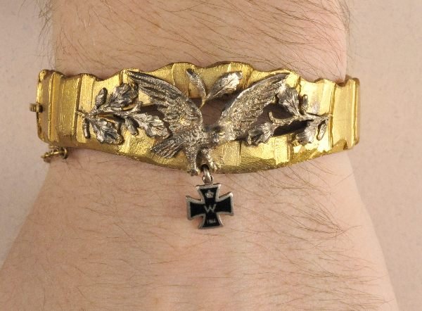 Prussia - Patriotic jewellry.: Prussia - Patriotic jewellry. Gilded grenade ring inside made out of silver hallmarked 900 F sun and S fastener with chain on the side eagle with flowers made out of silver separatly attached with an 