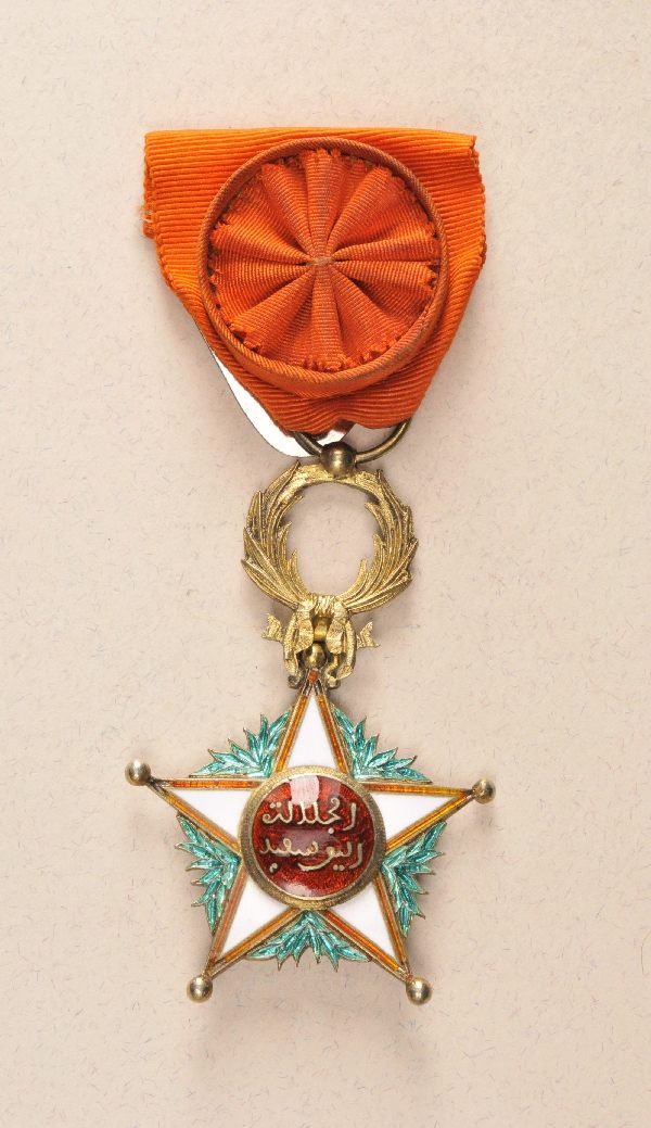 Morocco - Quissam-Alaouite-Order 3. model (since 1: Morocco - Quissam-Alaouite-Order 3. model (since 1966) officers decoration. Silver gilded enamelled multiple parts construction hallmarked on ready to wear ribbon with broach and attached rosette.#RF 