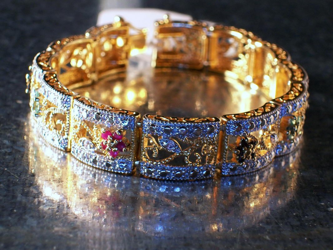 LOVELY FILIGREE STERLING AND GOLD OVERLAY 7 INCH BR: LOVELY FILIGREE STERLING AND GOLD OVERLAY 7 INCH BRACELET WITH GENUINE RUBIES, SAPPHIRES, EMERALDS AND DIAMONDS