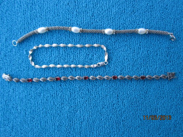 3 STERLING SILVER BRACELETS - 1 GARNET AND MARCASITE -: 3 STERLING SILVER BRACELETS - 1 GARNET AND MARCASITE - 1 PERL AND RHINESTONE - 1 TWISTED ROPE