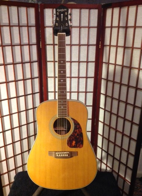 Epiphone masterbuilt acoustic guitar. This is a great: Epiphone masterbuilt acoustic guitar. This is a great guitar that is not electric.There is no cutaway.This guitar sounds great because of the rosewood back and sides